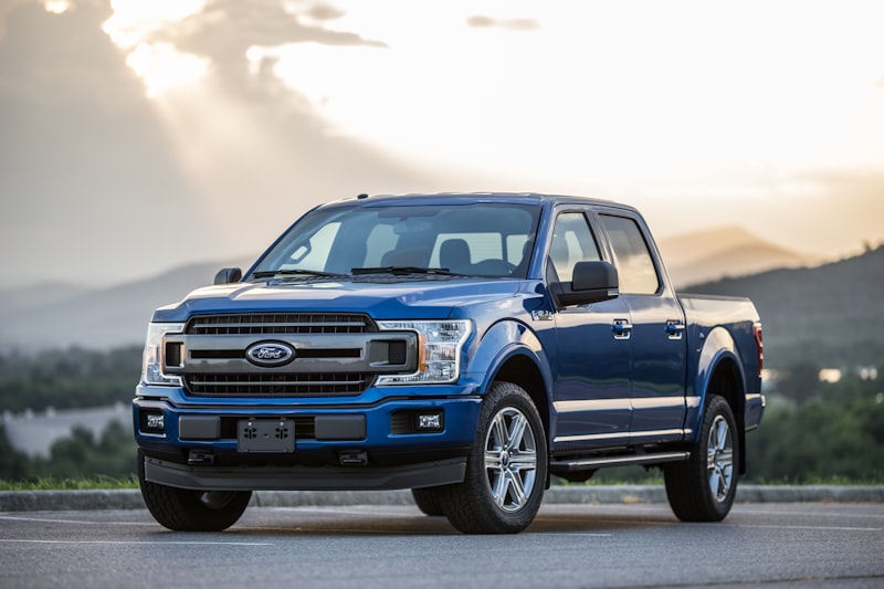 Blue Ford pickup truck with soft roll-up tonneau cover